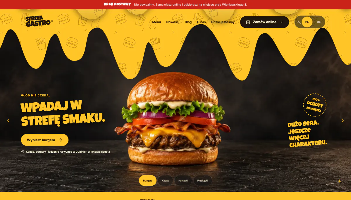 Strona strefa-gastro.pl z burgerem i przyciskiem Zamów online